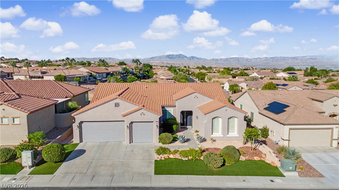2073 Fountain City Street, Henderson, NV 89052 This beautiful home features a tile roof, lush, low-maintenance landscaping, all framed by sweeping mountain views.