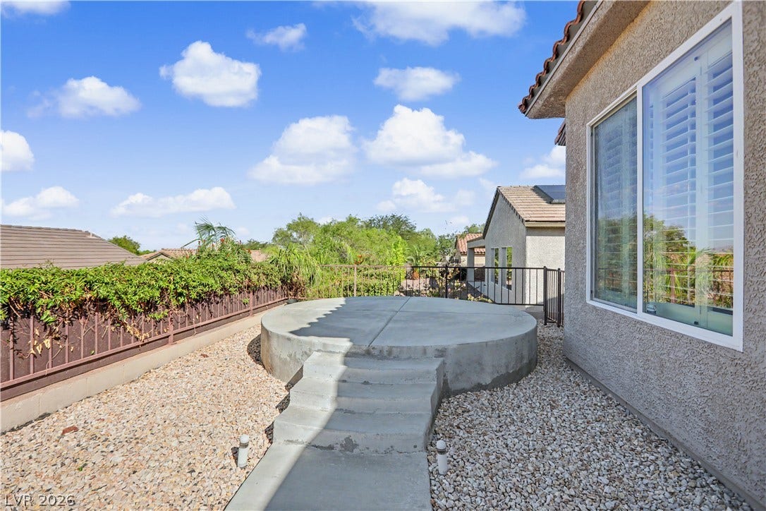 2073 Fountain City Street, Henderson, NV 89052 This raised patio pad is ready for your fire pit, lounge chairs, or perhaps a hot tub retreat.