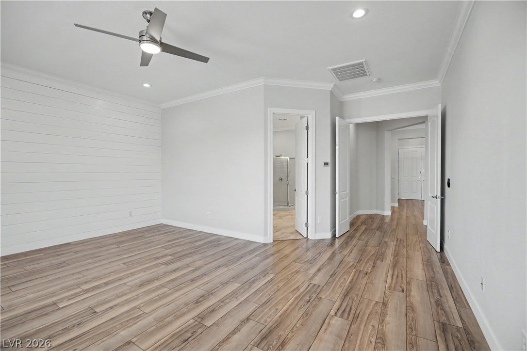 2073 Fountain City Street, Henderson, NV 89052 Privacy and space come together in this primary suite, tucked behind double doors with its own en suite bath and glass-enclosed shower.