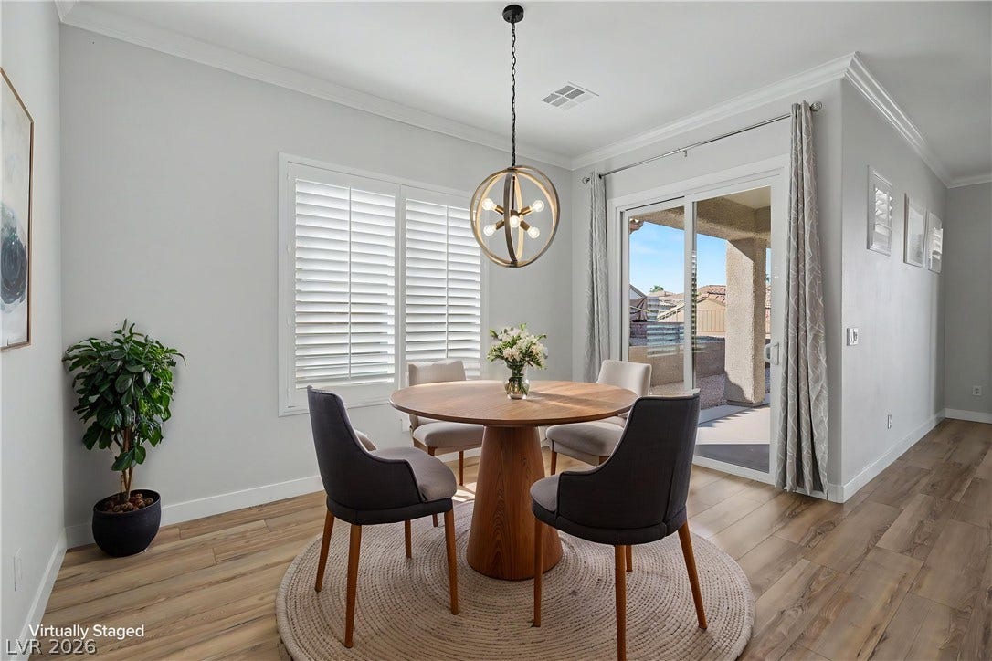 2073 Fountain City Street, Henderson, NV 89052 Perfect for casual meals or morning coffee, this cozy nook sits just off the kitchen with easy access to the backyard.