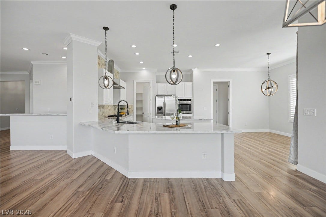 2073 Fountain City Street, Henderson, NV 89052 Picture yourself cooking dinner while family and friends gather around the island. This open, light-filled kitchen makes every day feel like a celebration.