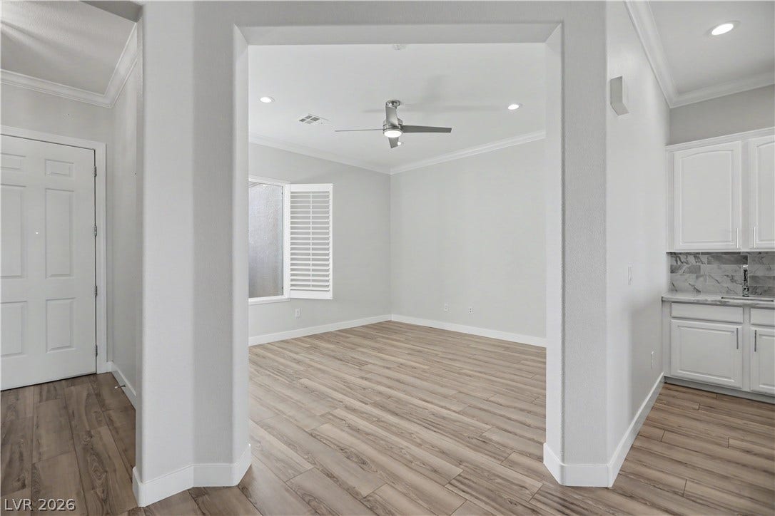 2073 Fountain City Street, Henderson, NV 89052 A versatile den with crown molding, a modern ceiling fan and plantation shutters works beautifully as a home office, reading room, or hobby space.