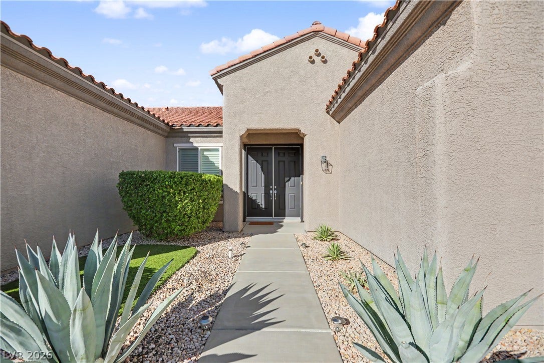 2073 Fountain City Street, Henderson, NV 89052 A private walkway with low-maintenance desert plants guides you to the double door entry.