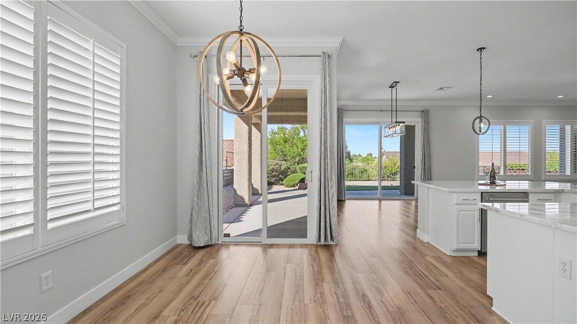 2073 Fountain City Street, Henderson, NV 89052 Lots of windows and two patio sliders fill this open space with natural light, and you'll catch backyard views from almost everywhere you stand.