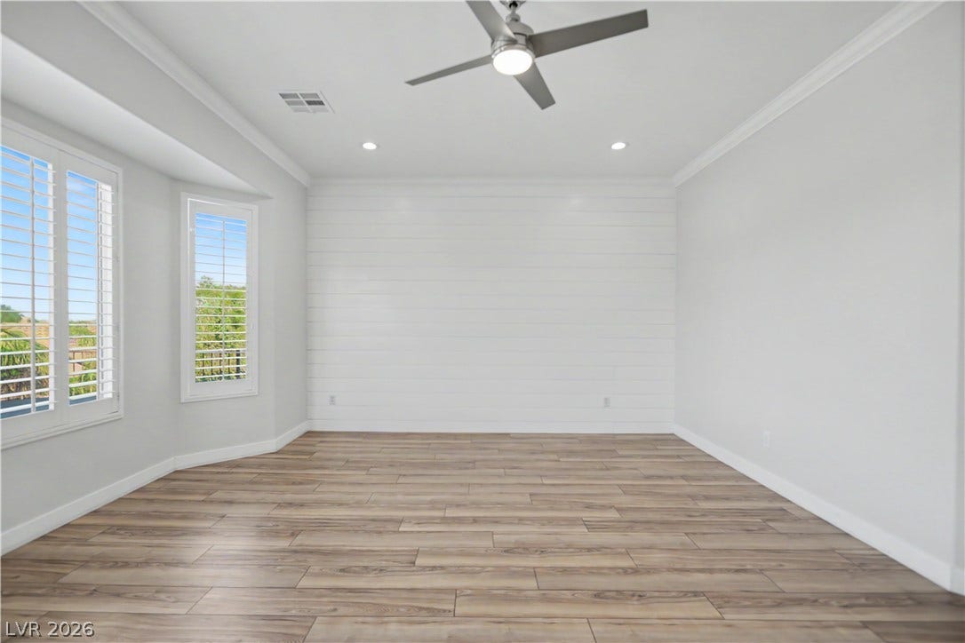 2073 Fountain City Street, Henderson, NV 89052 A crisp white shiplap accent wall makes the perfect backdrop for your bed, adding texture and modern farmhouse charm to the primary suite.