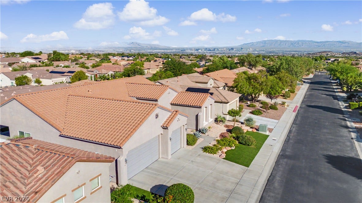2073 Fountain City Street, Henderson, NV 89052 Beautiful curb appeal, three car garage and a backdrop of mountains and city skyline truly makes this home standout.