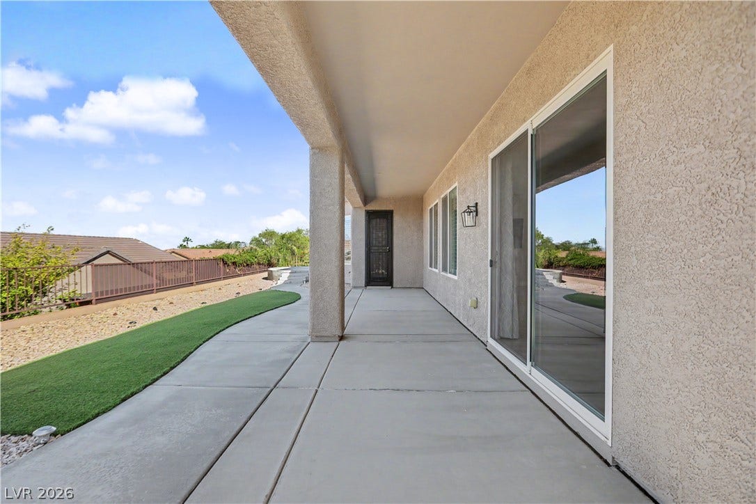 2073 Fountain City Street, Henderson, NV 89052 This long covered patio sits alongside low maintenance turf and desert landscaping.
