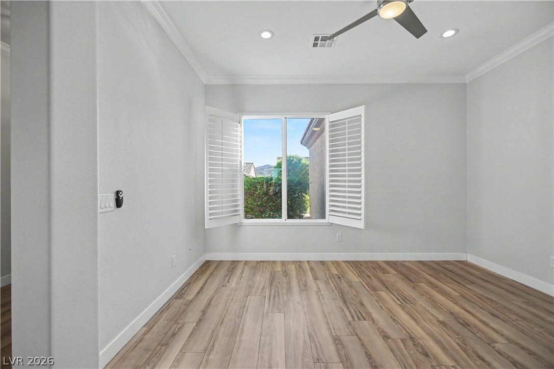 2073 Fountain City Street, Henderson, NV 89052 Open the plantation shutters to reveal views of lush greenery and a peek of the mountains.