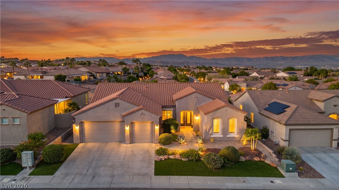 2073 Fountain City Street, Henderson, NV 89052 Welcome home! This stunning single story home glows at sunset with a three car garage, double front doors and mountain views.