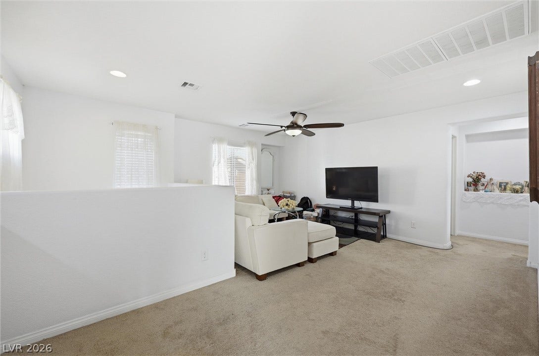 7057 Millers Run Street, North Las Vegas, NV 89084 Generous upper-level loft area boasts plush carpeting and abundant natural light.