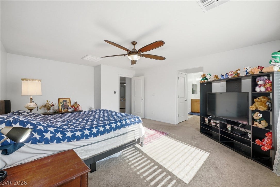 7057 Millers Run Street, North Las Vegas, NV 89084 Soft carpeting underfoot defines this comfortable bedroom retreat complete with an adjacent bath.