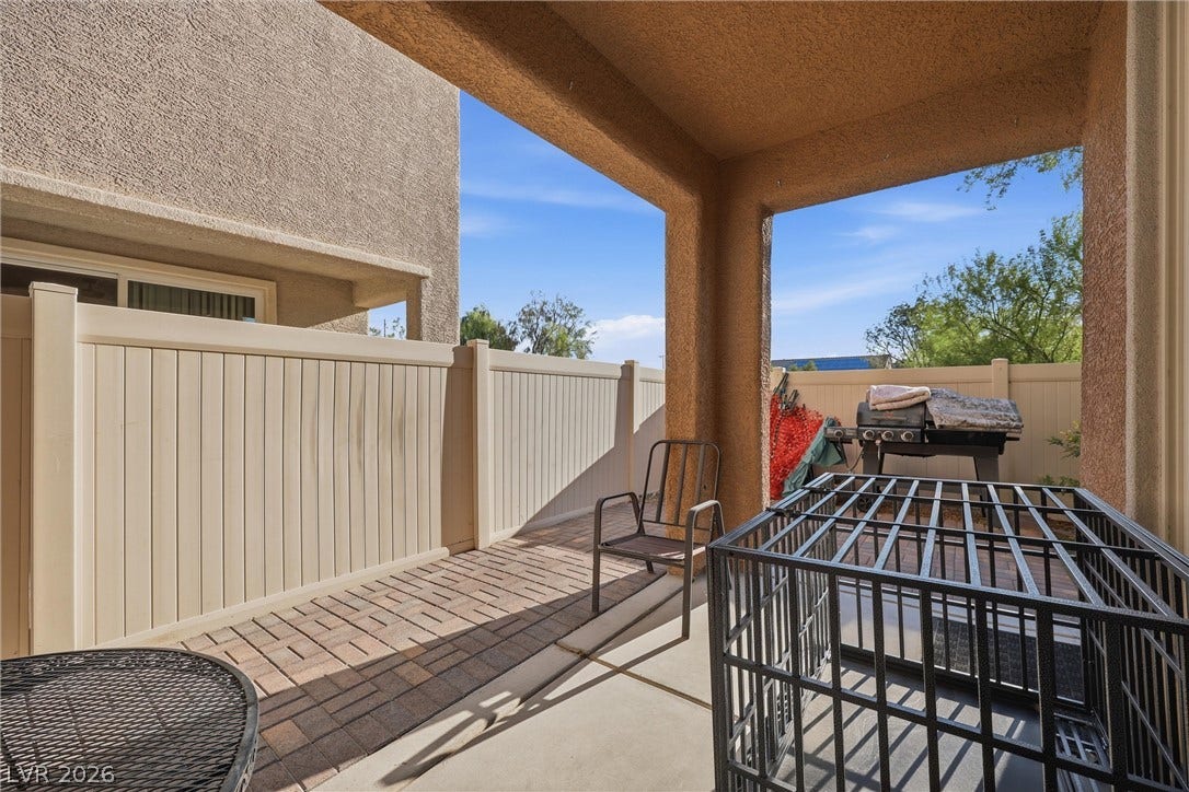 7057 Millers Run Street, North Las Vegas, NV 89084 An inviting covered patio features durable paver flooring and stucco pillars.