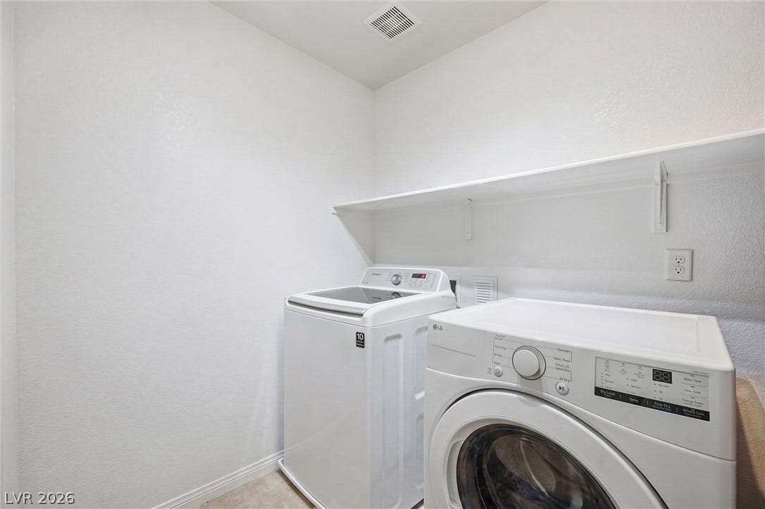 7057 Millers Run Street, North Las Vegas, NV 89084 Practical utility space features built-in shelving overhead and durable flooring.