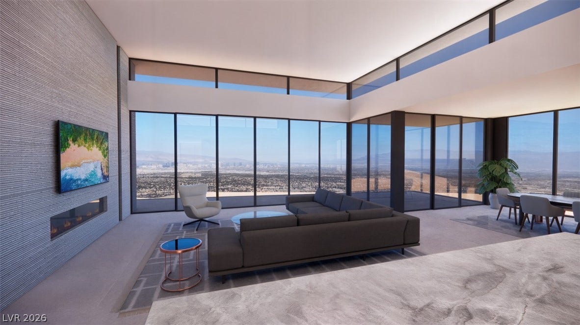 7 Chisel Crest Court, Henderson, NV 89012 Towering window walls reveal sweeping valley views from this modern open-concept living area.