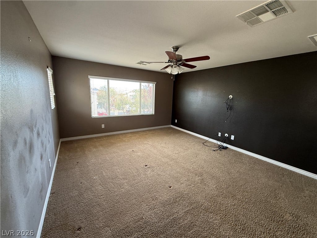 5904 Gold Horizon Street, North Las Vegas, NV 89031 Generous windows fill this versatile bedroom space with natural light.