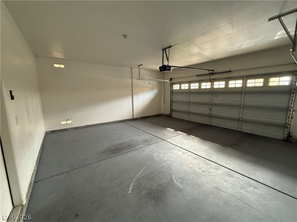 5904 Gold Horizon Street, North Las Vegas, NV 89031 An attached two-car garage features a durable concrete floor and an automatic garage door opener.