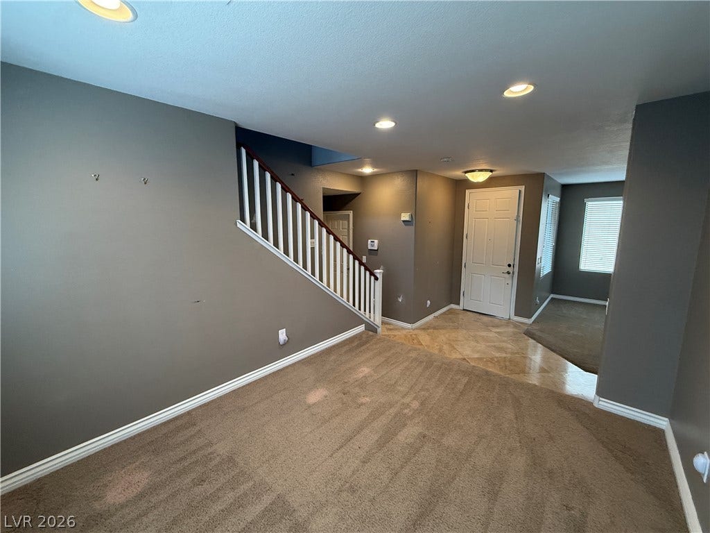 5904 Gold Horizon Street, North Las Vegas, NV 89031 Plush carpeting meets polished tile flooring in this welcoming entryway complete with modern recessed lighting.