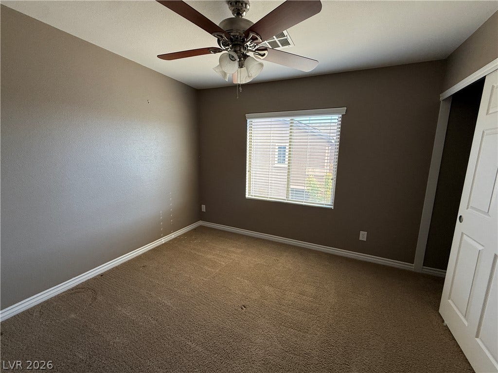 5904 Gold Horizon Street, North Las Vegas, NV 89031 Plush carpeting and a wide window with integrated blinds enhance this comfortable room.