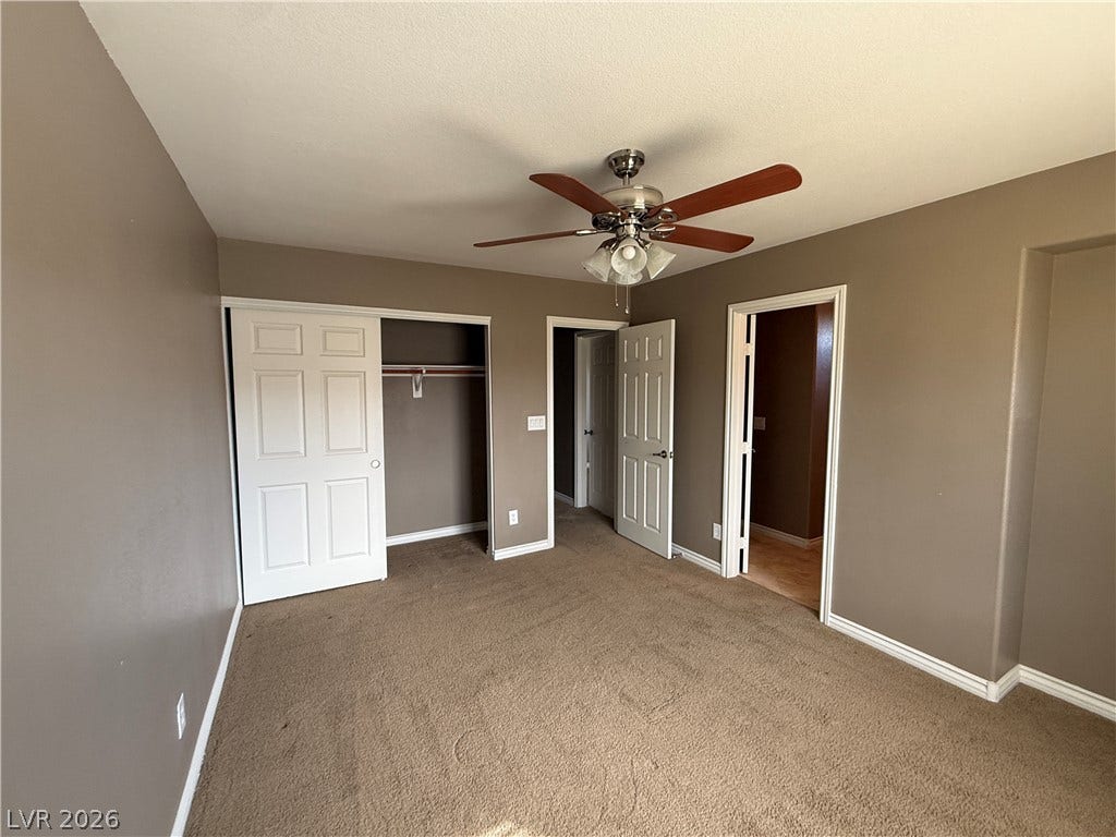 5904 Gold Horizon Street, North Las Vegas, NV 89031 Plush wall-to-wall carpeting and crisp white trim define this comfortable bedroom space.