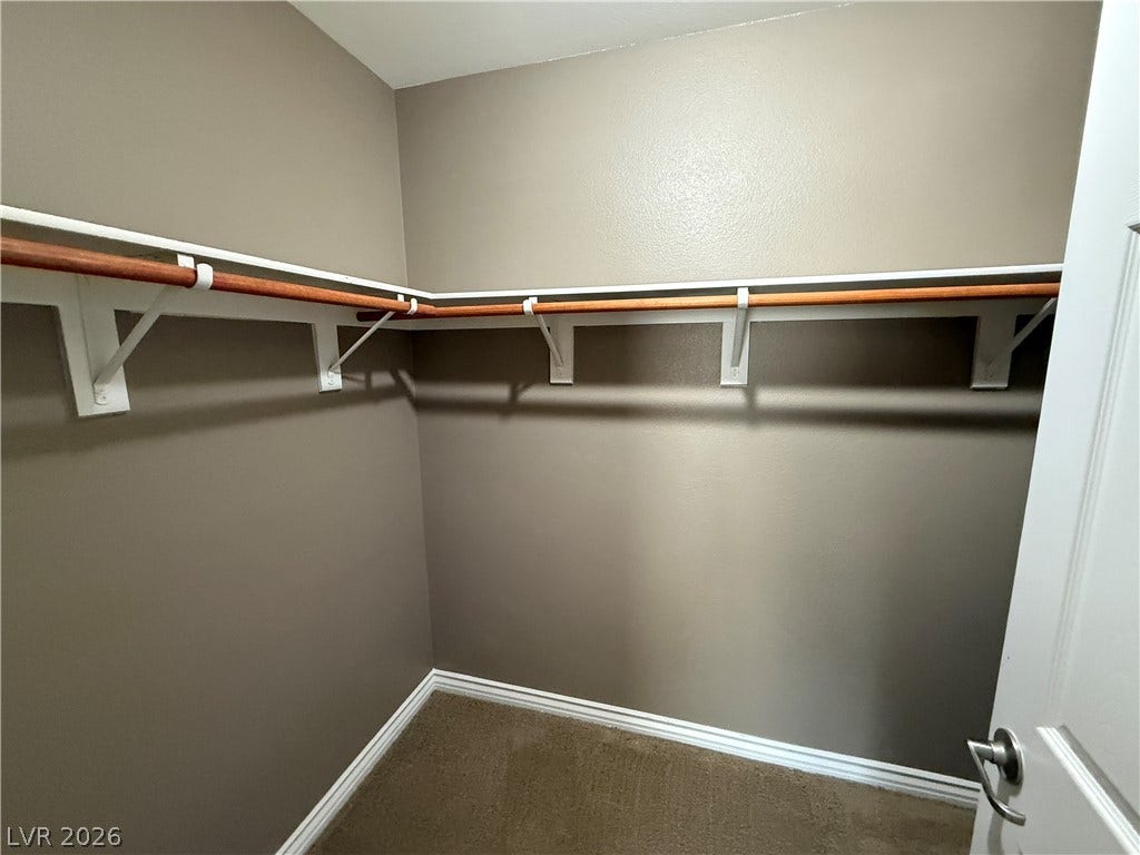 5904 Gold Horizon Street, North Las Vegas, NV 89031 Ample hanging rods and overhead shelving maximize organization within this walk-in closet.