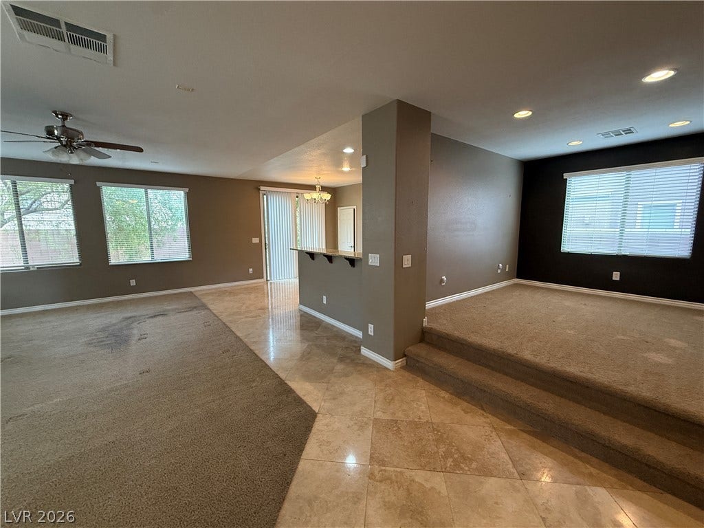 5904 Gold Horizon Street, North Las Vegas, NV 89031 Polished tile flooring transitions to carpeted living zones under recessed lighting.