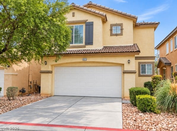 4421 Oberlander Avenue, North Las Vegas, NV 89031 Stucco exterior walls paired with a tile roof define this two-story residential facade.