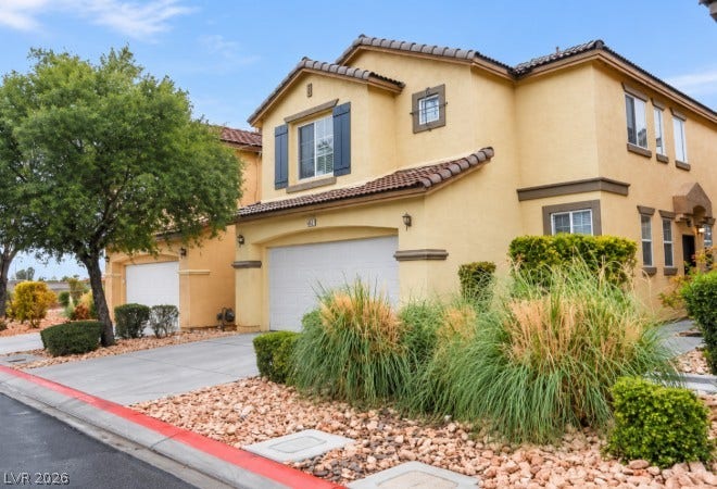 4421 Oberlander Avenue, North Las Vegas, NV 89031 Mediterranean architectural details and mature desert plantings create welcoming curb appeal.