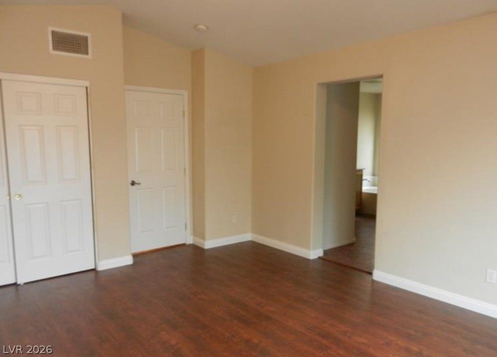 4421 Oberlander Avenue, North Las Vegas, NV 89031 Gleaming hardwood floors and a spacious layout define this versatile primary suite.