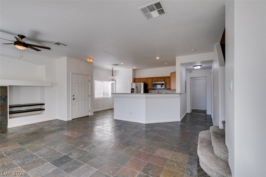 3612 Indigo Flower Street, #2, North Las Vegas, NV 89084 An open floorplan seamlessly connects the living space to the kitchen over durable tile flooring.