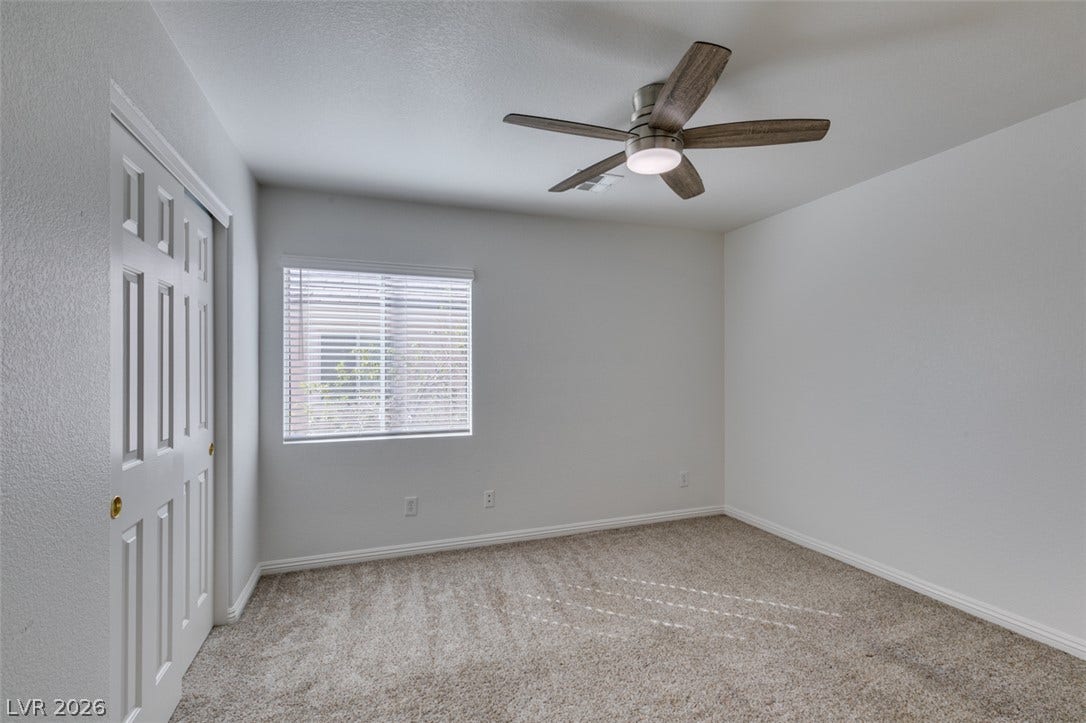 3612 Indigo Flower Street, #2, North Las Vegas, NV 89084 Soft carpet flooring underfoot anchors this secondary bedroom with a sliding closet door.