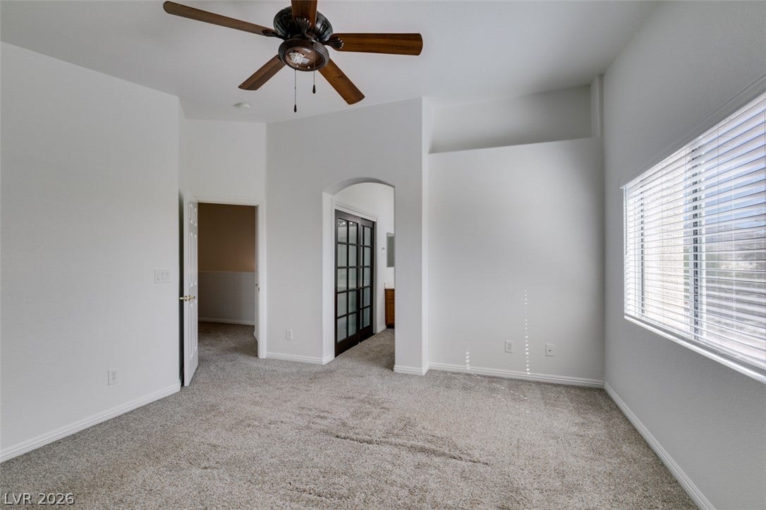 3612 Indigo Flower Street, #2, North Las Vegas, NV 89084 High ceilings and soft carpeting define this inviting upper-level bedroom space.
