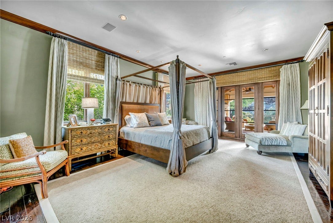 1793 Anelli Court, Henderson, NV 89012 Rich wood trim and elegant French doors define this peaceful primary bedroom retreat.