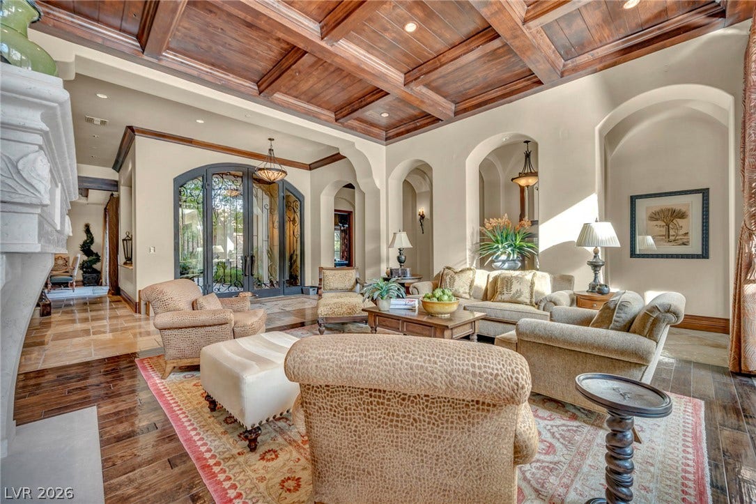 1793 Anelli Court, Henderson, NV 89012 Richly detailed coffered wood ceilings and polished hardwood flooring define this elegant living space.