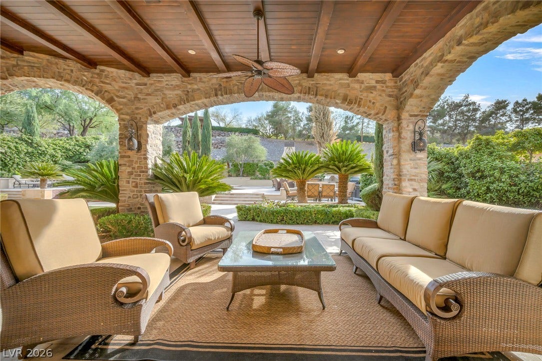 1793 Anelli Court, Henderson, NV 89012 An inviting covered patio showcases handsome wood-plank ceilings and rustic stone archways.