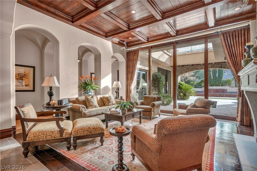 1793 Anelli Court, Henderson, NV 89012 Rich wood coffered ceilings and arched entries define this elegant living space.