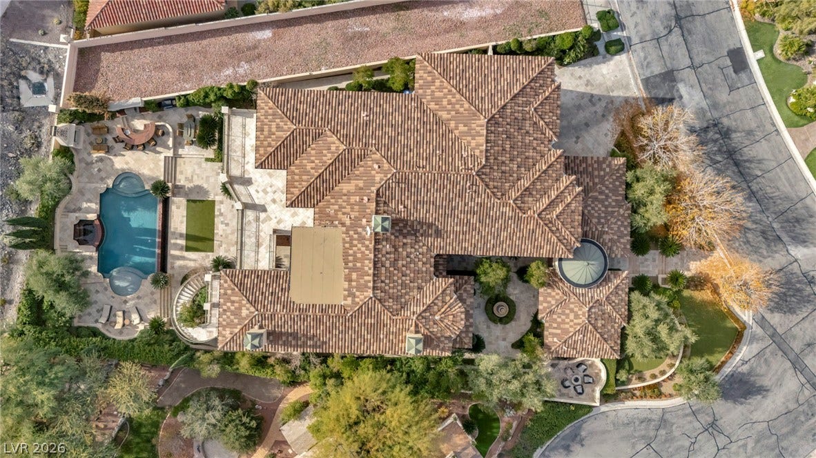 1793 Anelli Court, Henderson, NV 89012 An aerial perspective showcases a detailed tile roof alongside a private pool and patio.