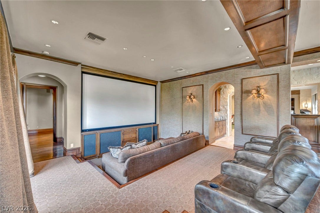 1793 Anelli Court, Henderson, NV 89012 Plush tiered seating and rich wood accents define this dedicated home cinema space.