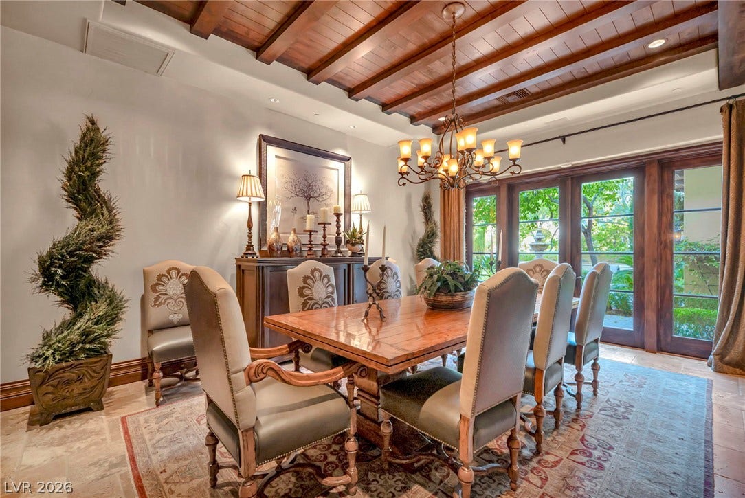 1793 Anelli Court, Henderson, NV 89012 Rich wood ceilings and polished stone flooring define this elegant dining room.