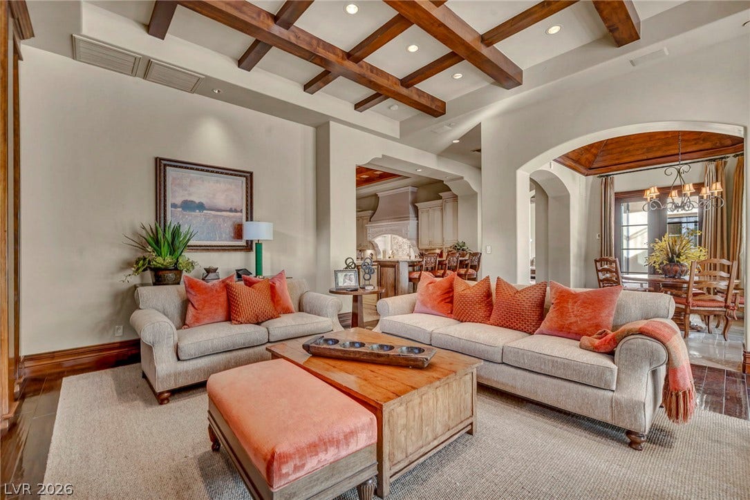 1793 Anelli Court, Henderson, NV 89012 Rich wood ceiling beams and arched entries define this refined, open living space.