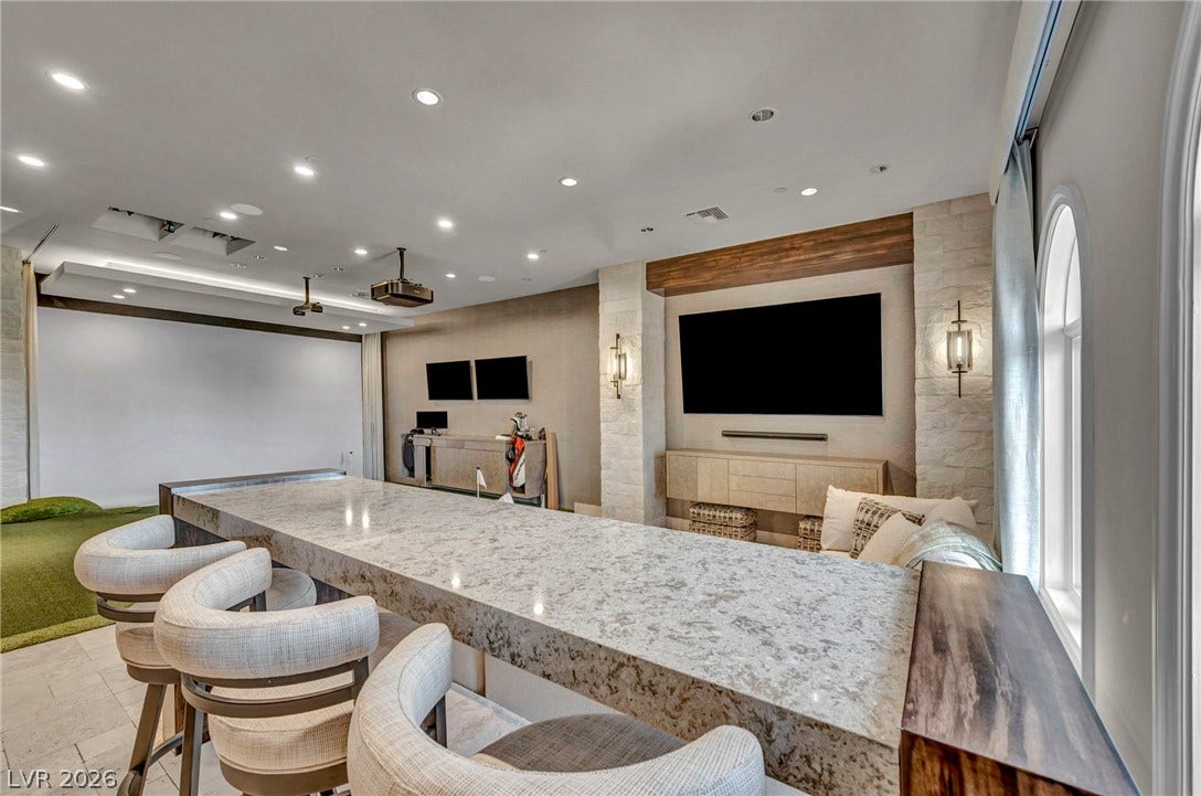 1793 Anelli Court, Henderson, NV 89012 Gleaming stone counters and warm wood accents define this media and recreation room.