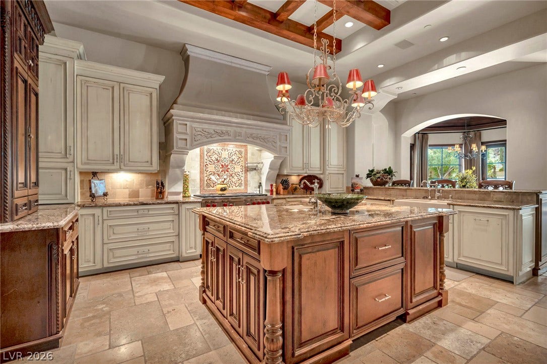 1793 Anelli Court, Henderson, NV 89012 Gourmet kitchen features a large center island under a detailed beamed ceiling.