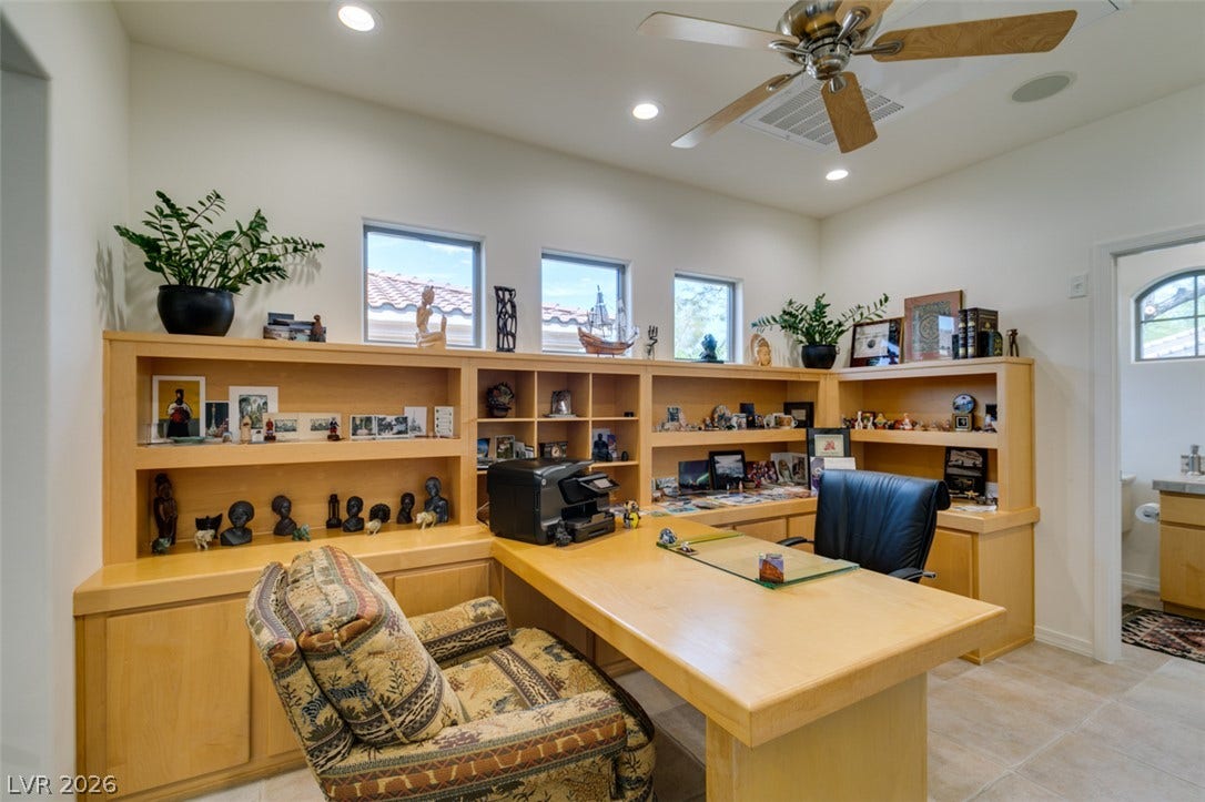 51 E Braelinn Drive, Henderson, NV 89052 Custom built-in shelving and ample desk space define this functional home work space.