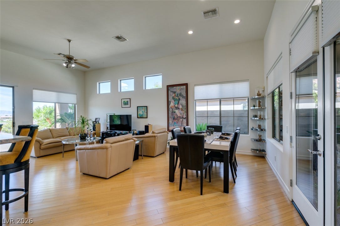 51 E Braelinn Drive, Henderson, NV 89052 Warm hardwood floors and high ceilings define this open-concept main level.
