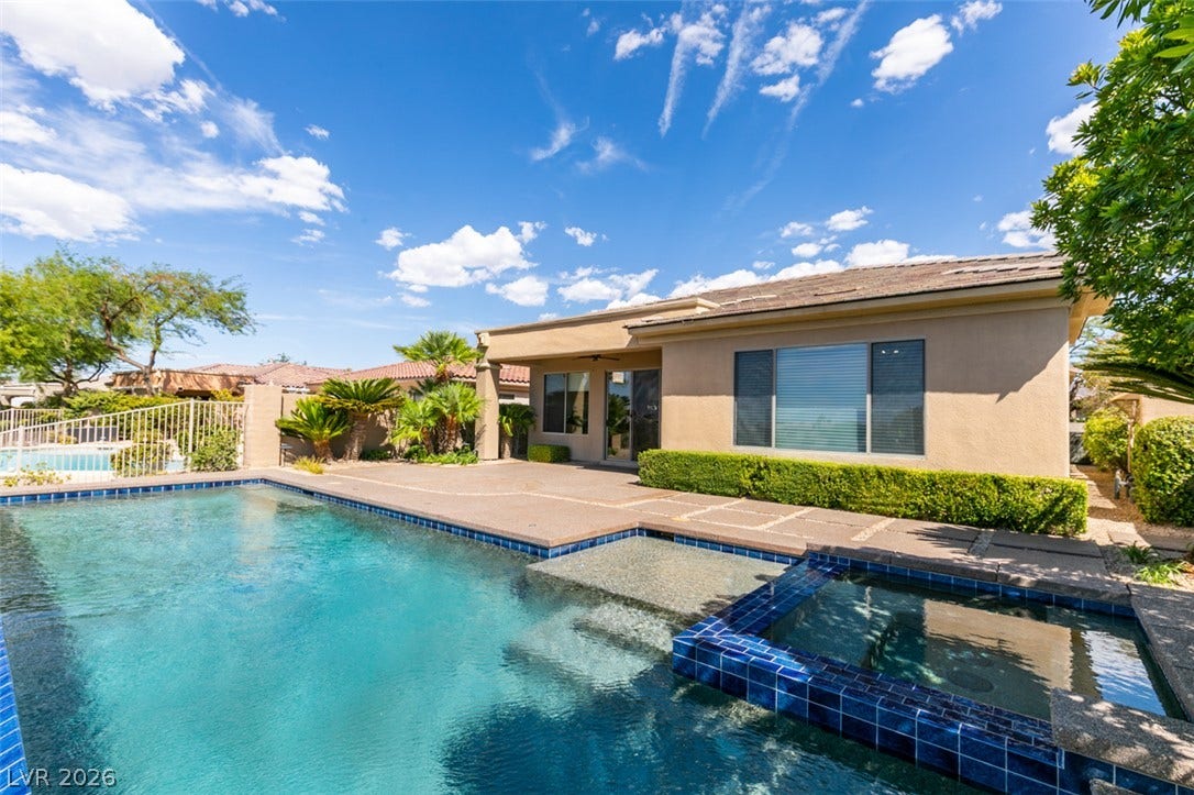 51 E Braelinn Drive, Henderson, NV 89052 A sparkling pool and integrated spa sit adjacent to the spacious paved patio.