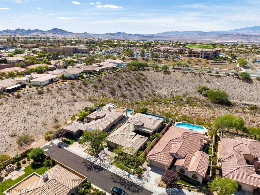 51 E Braelinn Drive, Henderson, NV 89052 Distant mountains frame a vast desert landscape stretching beyond this quiet residential community.