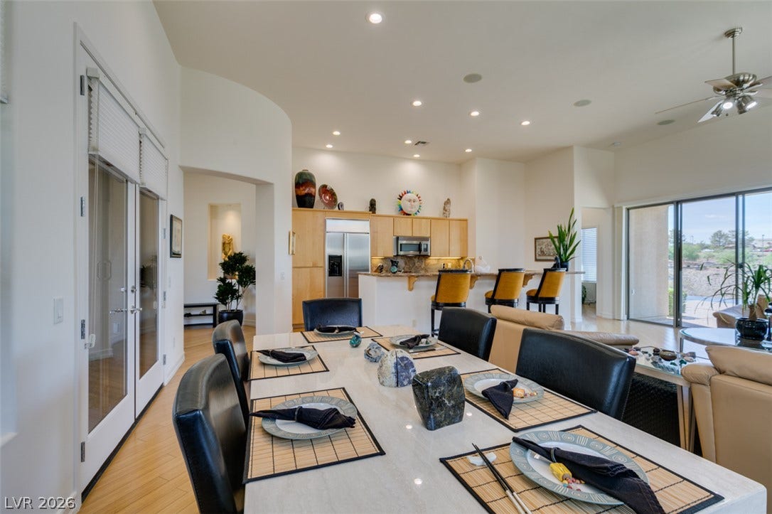 51 E Braelinn Drive, Henderson, NV 89052 Gleaming hardwood floors and recessed lighting anchor this airy dining space flowing into the kitchen.