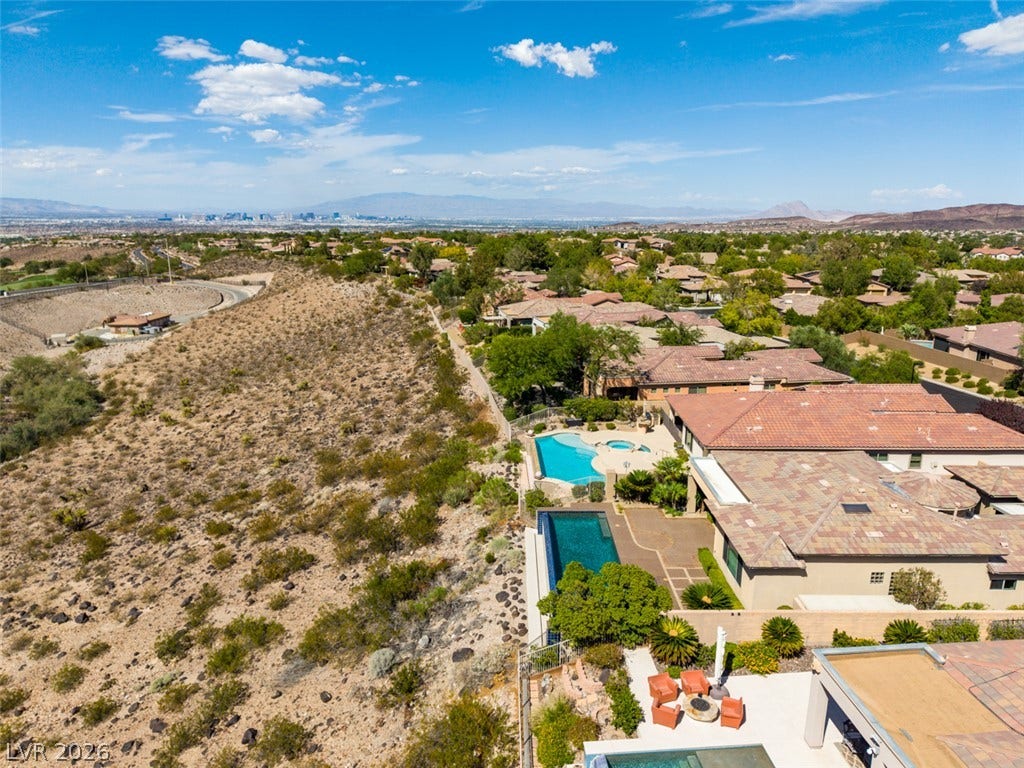 51 E Braelinn Drive, Henderson, NV 89052 An elevated perspective captures beautiful tile roofs nestled alongside scenic desert topography.