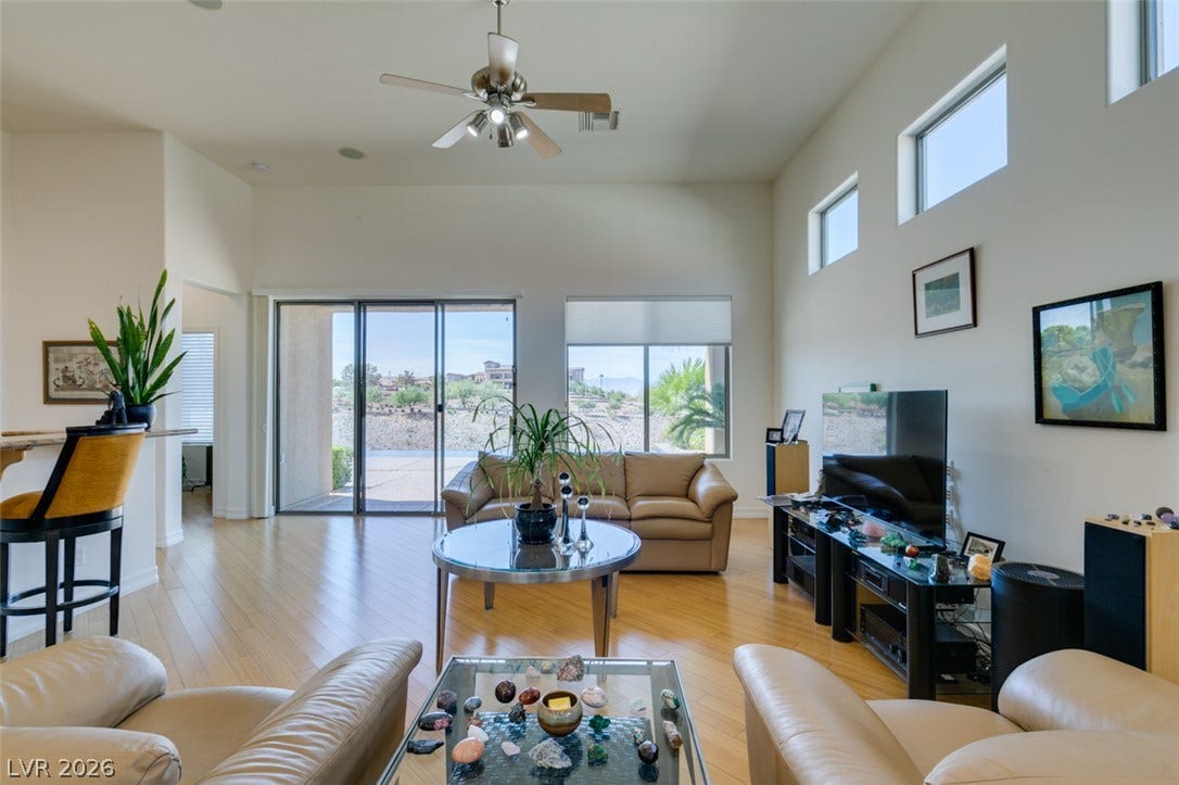 51 E Braelinn Drive, Henderson, NV 89052 High ceilings and gleaming wood flooring define this sunlit, open living area.