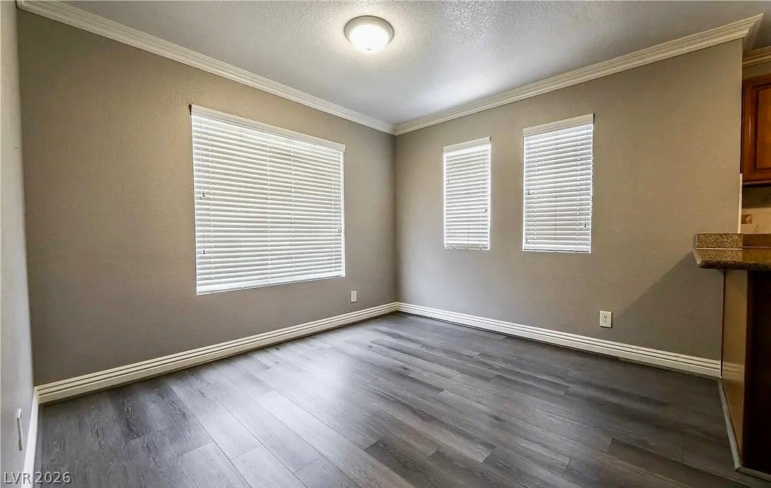 2700 N Rainbow Boulevard, #2137, Las Vegas, NV 89108 Elegant crown molding and smooth wood flooring define this versatile dining area.