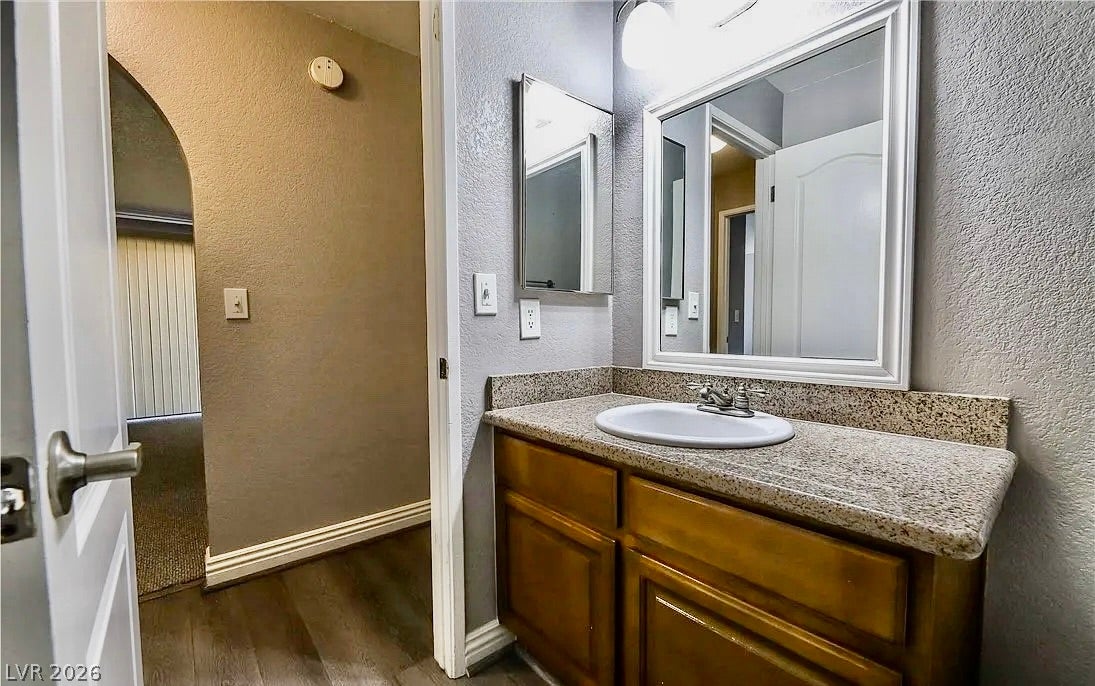 2700 N Rainbow Boulevard, #2137, Las Vegas, NV 89108 A classic wood vanity with granite counters is highlighted in this well-appointed bathroom.